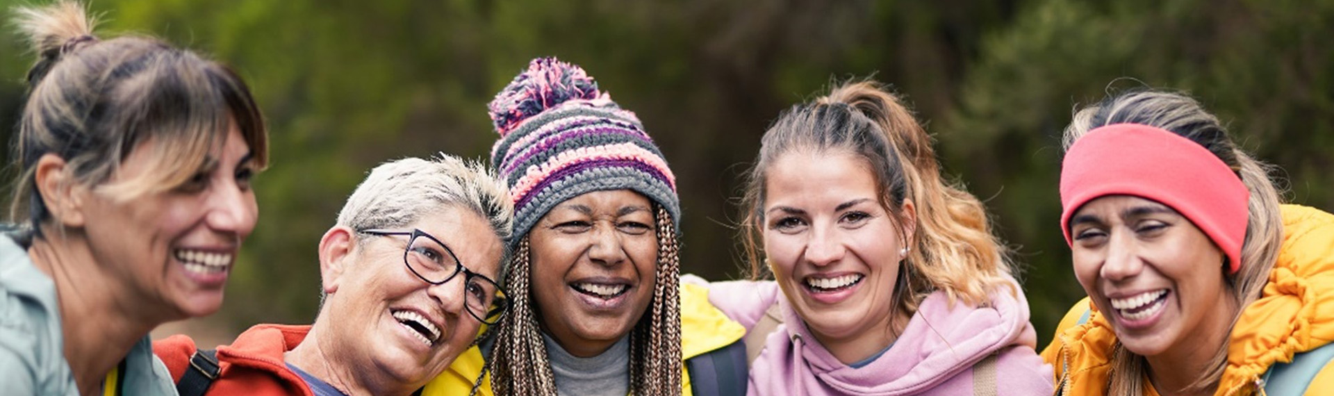 Women posing for a photo outdoors